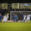 Annoying: Wycombe grab the equaliser that denied Dons all three points for the third game in succession     SP72885