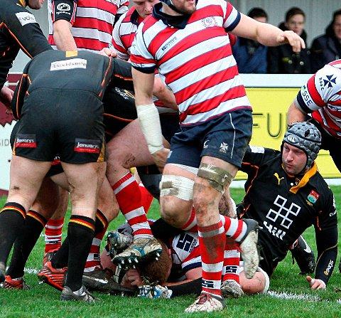 Try-tastic: Under this pile is Hugo Ellis, scoring one of his seven seven tries against Cambridge      Picture: David Whittam