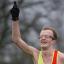 First man home: Ollie Garrod celebrates crossing the line first in the Surrey League Divsion Two meeting on Mitcham Common    SP73251