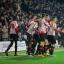 Celebration time: Donaldson is mobbed by his team-mates after scoring the winner on Tuesday