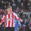 Opener: Brentford's Marcello Trotta celebrates scoring his side's first goal on Sunday