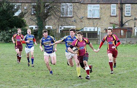 On the charge: Streatham-Croydon's Tom Watson moves through the Worth Old Boys lines    SP72944