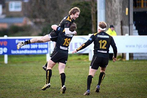 You beauty: Esher's Harlequins academy winger Charlie Walker celebrates his game clinching score against Blaydon