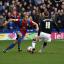 New man: Jazz Richards moves on of defence during his debut in a Palace shirt   SP72945