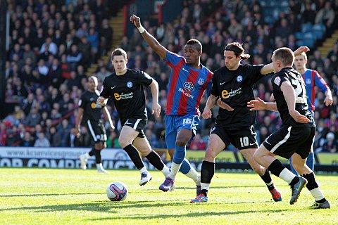 George Boyd (right) challenges Wilfried Zaha when Posh visited Selhurst last season