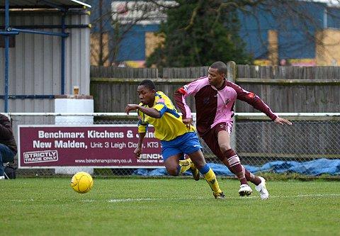 Competitive edge: Walton &amp; Hersham's Victor Kiri and Corinthian Casuals' Danny Green battle for possession on Saturday