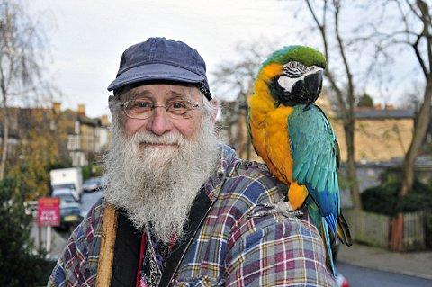 Charles Harwood with his parrot Jack.