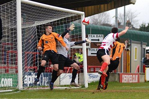 Top jump: Matt Pattison gets up to head home to put Ks 3-0 up