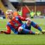 Down but not out: Jonny Williams finds himself on the deck against Middlesbrough, but the winger would have the last laugh    SP72947