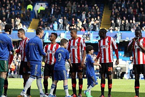 Not here to make up the numbers: Brentford and Chelsea greet each other ahead of the FA Cup replay on Sunday        SP74039