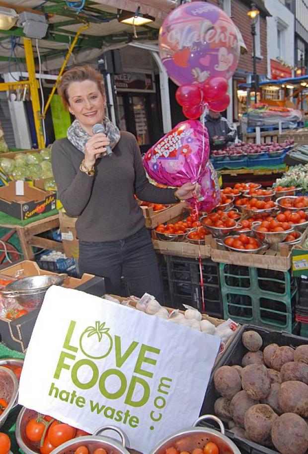 Alison Plant serenades market shoppers.