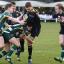 Back foot: Esher's Chris Elder is felled by the Ealing Trailfinders defence last week