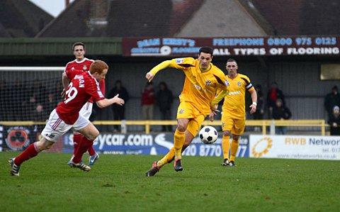 New boy: Tommy Kavanagh, right, in action for Sutton United against Blue Square Premier leaders Wrexham in the FA Trophy