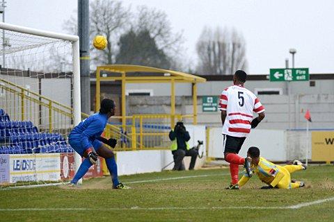 Close: Ian Gayle just fails to test the Canvey Island keeper in the 2-1 defeat at Kingsmeadow on Saturday SP72984