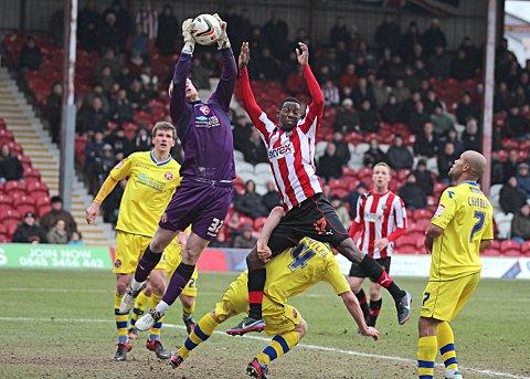 Flyer: Brentford’s Bradley Wright-Phillips challenges Walsall keeper Aaron McCarey 	SP73020