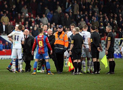 Get out of my way: Ian Holloway pushes Kevin Phillips out of the way as he tries to get to referee Dean Whitestone on Saturday