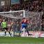On my head son: Murray heads home the opener from Jonny Williams's cross
