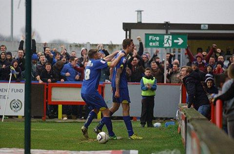 Happy days: Celebration time at Kingsmeadow in the 3-2 win over York on Saturday SP74681