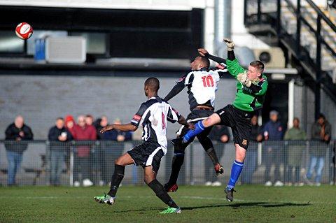 Crowded out: Tooting force the Three Bridges keeper into a rare bit of action on Saturday on their way to a disappointing defeat
