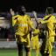 Here's to you: Harry Beautyman congratulates Craig Dundas on yet another goal, his 13th in the league, this season Picture: Paul Loughlin