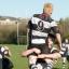 Let the celebrations begin: Sutton & Epsom skipper Matt Whitaker lifts Frankie Murray aloft as promotion to London Division One South becomes a reality