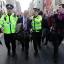 Ukip leader Nigel Farage is escorted by police officers as he leaves the Canons' Gait pub in Edinburgh amid a protest