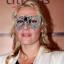 Kate Winslet wears a Beaton's Atelier ball mask to host a London fundraising dinner for the charity Cardboard Citizens