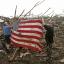 Residents place an American flag on debris in Moore, Oklahoma (AP)