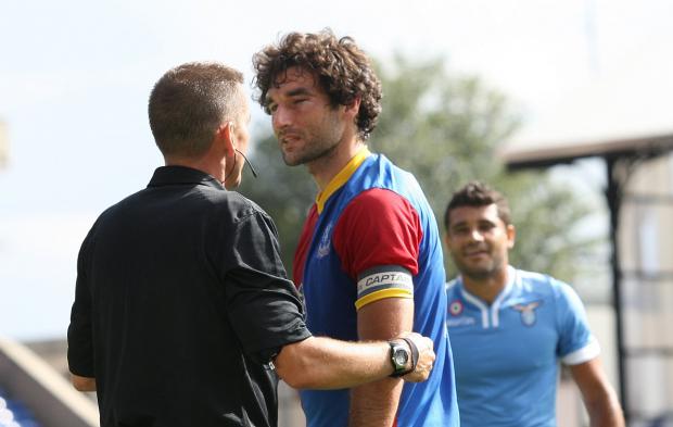Tough cookie: Mile Jedinak was forced off on Saturday after being caught on the eye but it won't stop him playing on Sunday