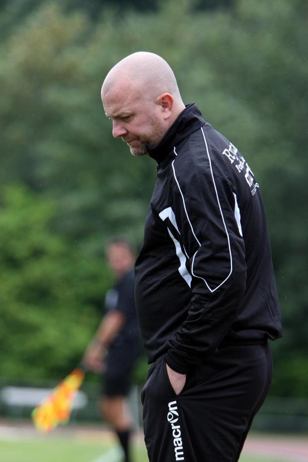 Bad day at the office: Walton & Hersham's Steve Baker suffers during a 4-0 home defeat to Hythe Town SP78635