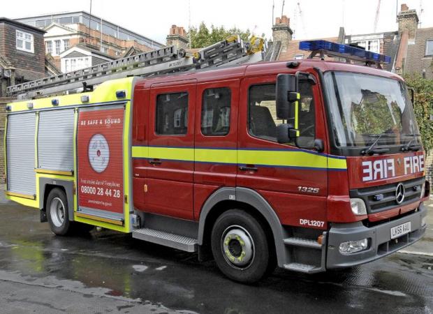 Firefighters help woman escape kitchen fire
