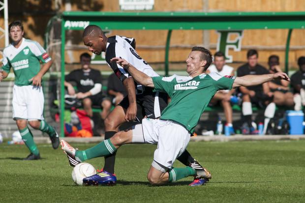 None shall pass: Tanners Matt Smart stops Terrors Sol Pinnock in his tracks during the 1-0 FA Cup win at Fetcham Grove last weekend SP73087