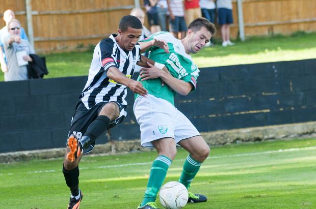 Streatham Guardian: Goal-scorer: Leatherhead's Tom Parkinson does battle with Tooting's Troy Williams SP73087 Streatham Guardian: Goal-scorer: Leatherhead's Tom Parkinson does battle with Tooting's Troy Williams SP73087