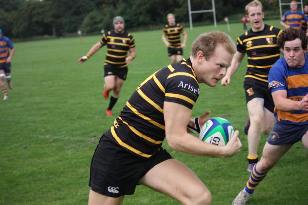 On the run: Phil Francis heads for the line to score his try. Credit Ben Gilby