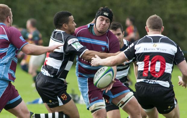 Tough day: Wimbledon's Jack Fishwick cannot find a way past the Gravesend defence SP79017