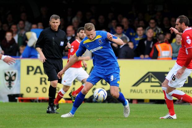 On target: Michael Smith's sixth goal of the season took a point off Morecambe SP79026