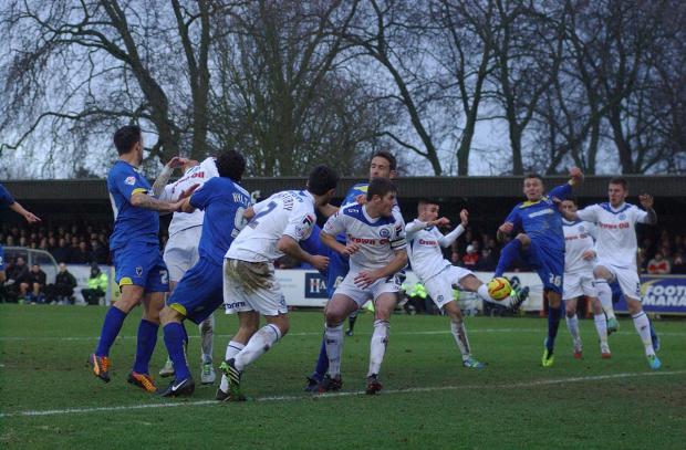 Streatham Guardian: Scramble: AFC Wimbledon rarely threatened the Rochdale goal SP81974 Streatham Guardian: Scramble: AFC Wimbledon rarely threatened the Rochdale goal SP81974