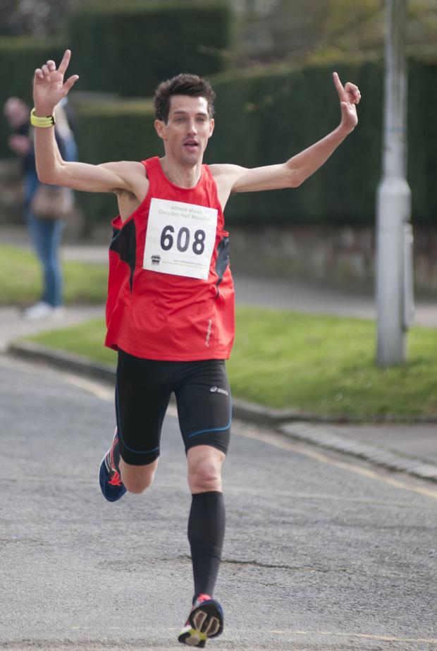 Streatham Guardian: Winner: Kevin Quinn is about to take the tape at the Streets Ahead Croydon half-marathon All pictures: SP83959 Streatham Guardian: Winner: Kevin Quinn is about to take the tape at the Streets Ahead Croydon half-marathon All pictures: SP83959