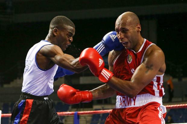 Streatham Guardian: Unstoppable: Joshua Buatsi, left, defeating Tom Barry in the semi-finals of the England Boxing Elite Championship, en route to becoming the English champion Streatham Guardian: Unstoppable: Joshua Buatsi, left, defeating Tom Barry in the semi-finals of the England Boxing Elite Championship, en route to becoming the English champion