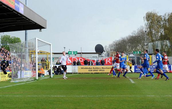 Streatham Guardian: Header of a hero: Fleetwood Town keeper Tom Davies can only watch as Gary Alexander’s header opens the scoring in the eventual 2-1 win that kept AFC Wimbledon in League Two in 2012 SP73108 Streatham Guardian: Header of a hero: Fleetwood Town keeper Tom Davies can only watch as Gary Alexander’s header opens the scoring in the eventual 2-1 win that kept AFC Wimbledon in League Two in 2012 SP73108