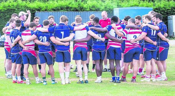 Streatham Guardian: Back together: Rosslyn Park head coach Alex Codling, in the white cap, holds court as the pre-season training gets back underway Picture: Charlie Addiman Streatham Guardian: Back together: Rosslyn Park head coach Alex Codling, in the white cap, holds court as the pre-season training gets back underway Picture: Charlie Addiman